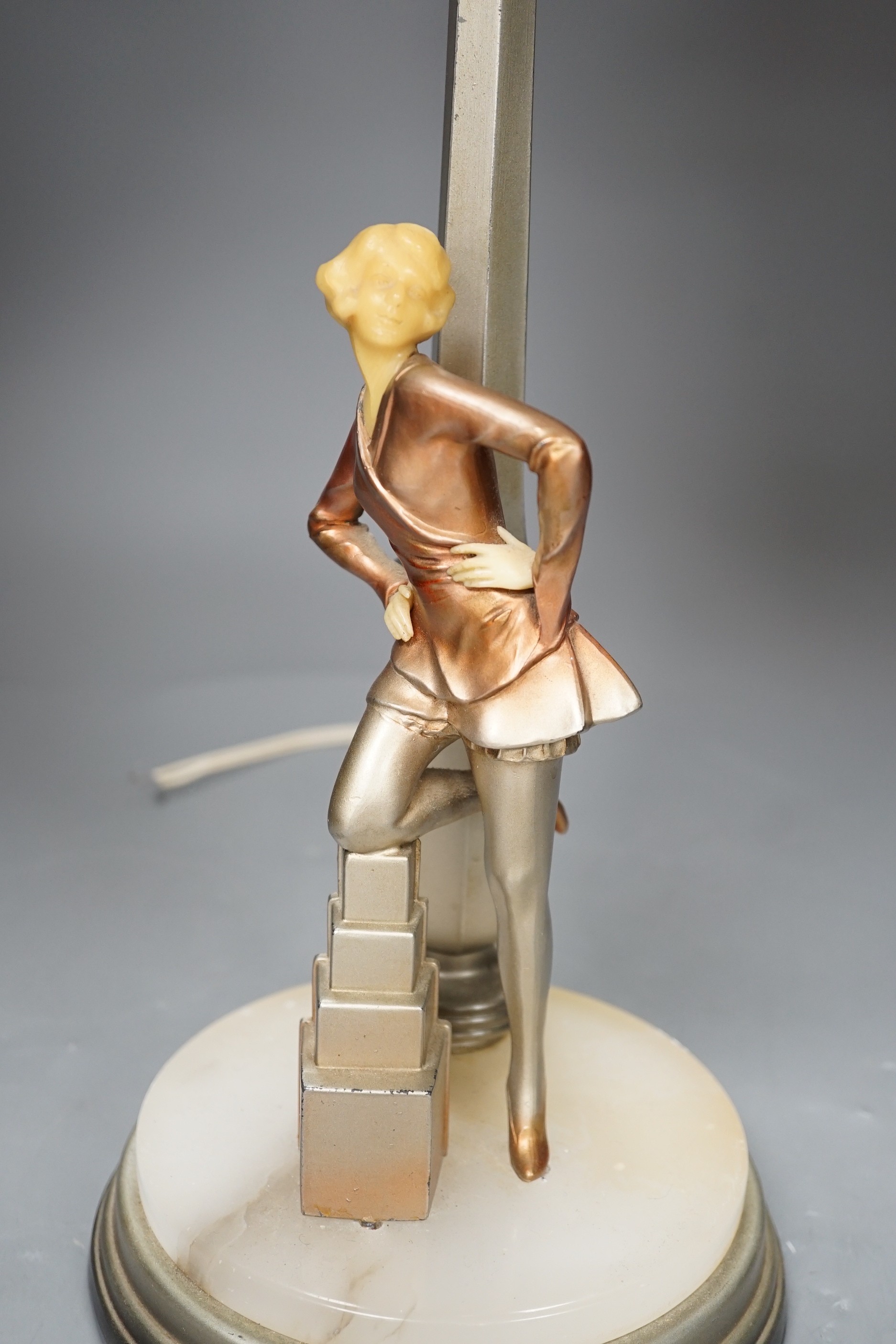 An Art Deco Cold painted spelter and composition figural table lamp and glass shade, 67cm high